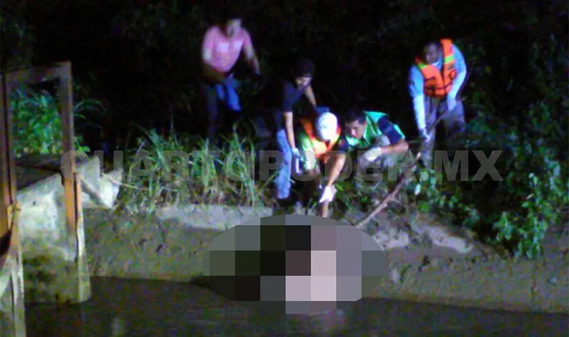 Localizan cadáver en un canal de riego