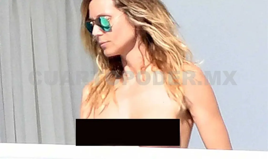 Heidi Klum se asolea en topless