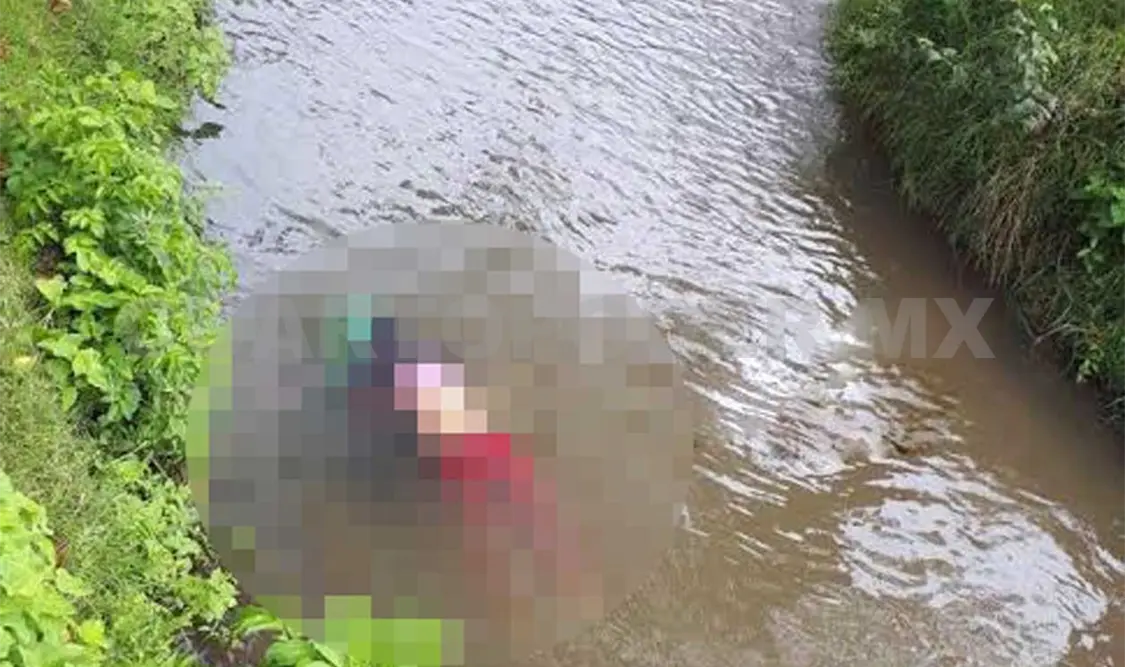 Hallan muerta a niña en canal de aguas negras
