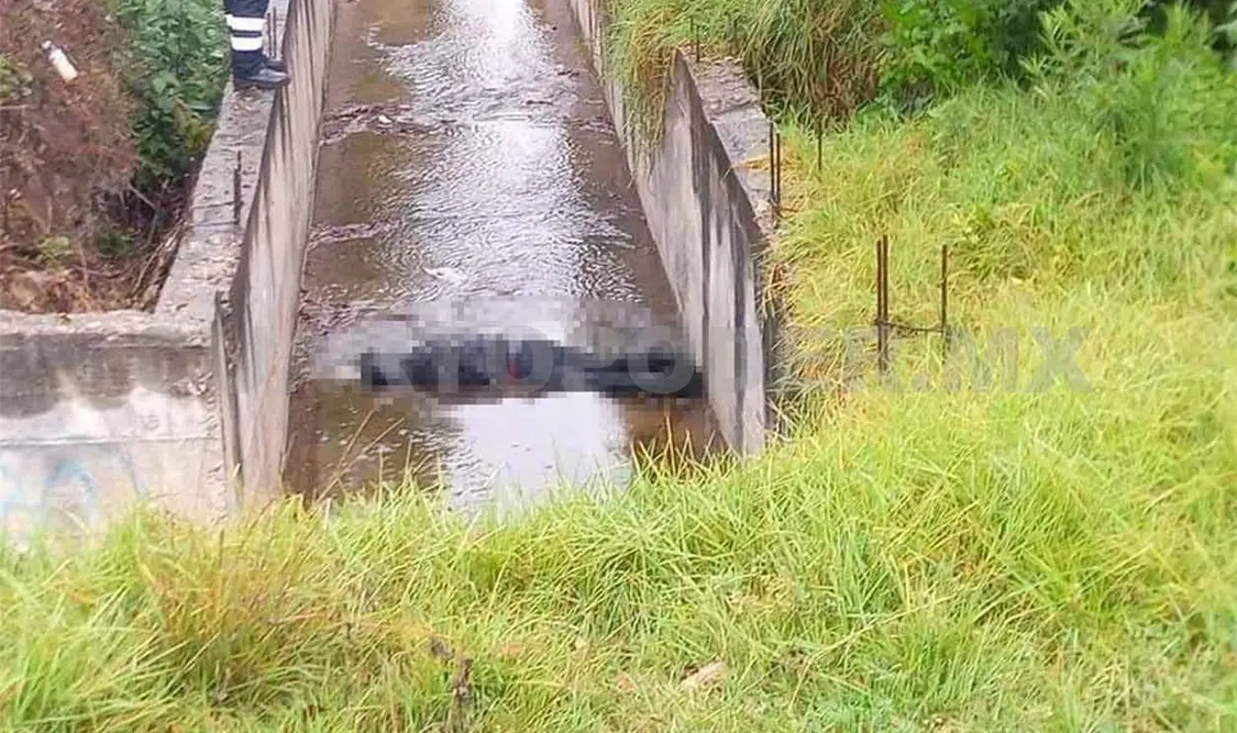 Aparece cadáver en un canal de aguas pluviales