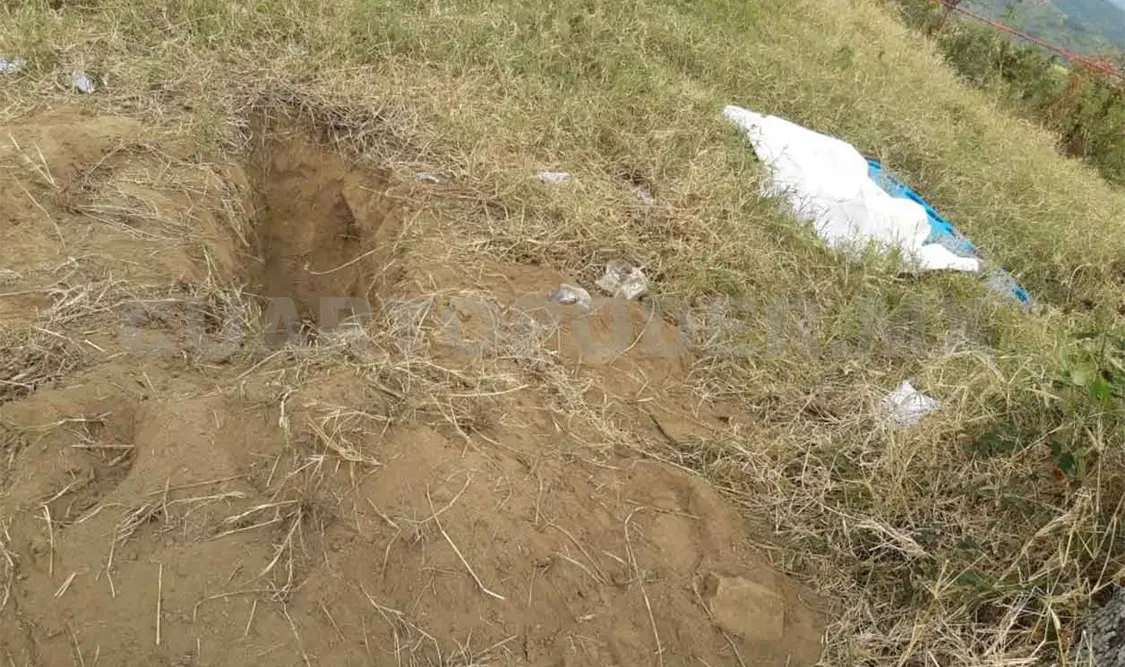 Asesinan a balazos a pandillero y lo entierran