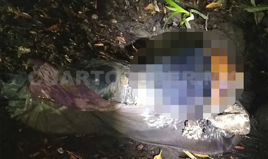 Envuelto en una sábana y atado de pies y manos fue localizado el cuerpo en el río Suchiate, la noche del pasado viernes. Víctor Sánchez / CP