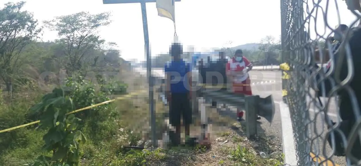 Lo encuentran ahorcado en señal de carretera