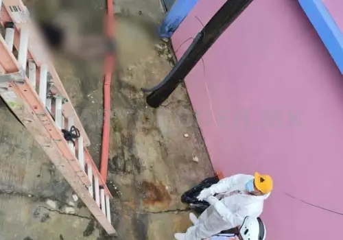Hallan cadáver al fondo de canal de desagüe