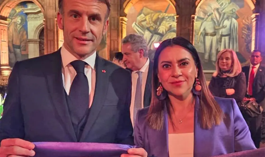 Emmanuel Macron y Olimpia Coral Melo, en cena en su honor. Cortesía
