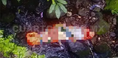 Localizan cuerpo envuelto en lona Localizan cuerpo envuelto en lona