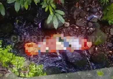 Localizan cuerpo envuelto en lona Localizan cuerpo envuelto en lona